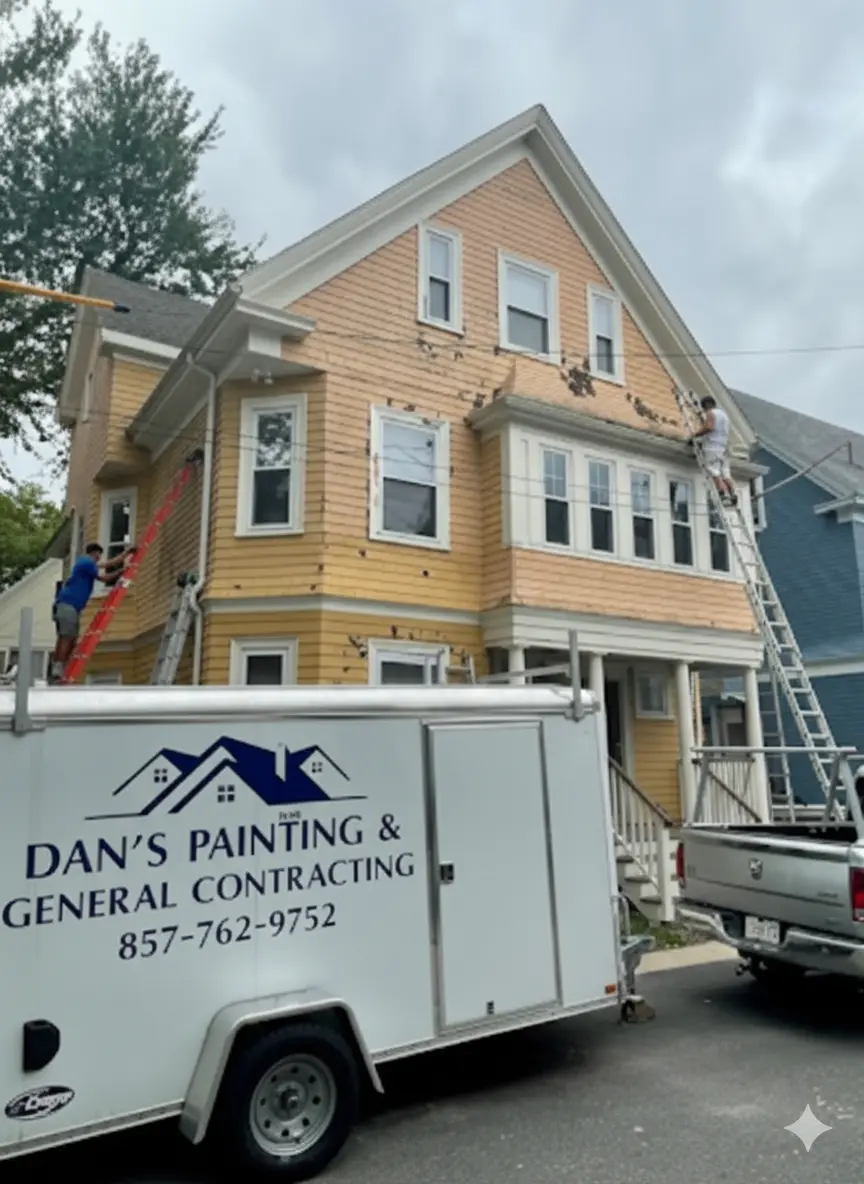 Dan's Painting & General Contracting crew prepping a yellow multi-family home for repainting in Cambridge, MA